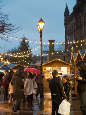 Chester: People visiting the Christmas market at Town Hall Square