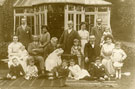 View: FD01065 Frodsham: Group by summer house.  Linaker Family?