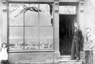 View: FD01287 Frodsham: Tom Davies outside his drapers shop, Five Crosses