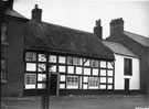 View: FD02209 Frodsham: Black / white thatched cottage,  Main Street.