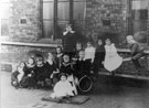View: FD02375 Frodsham: Schoolchildren on see-saw at Infants' School.  