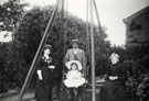 View: FD02567 Frodsham: Family Group with child on swing.  Unidentified.