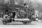 View: FD02707 Frodsham: Frodsham Marsh Carnival. [1925?], decorated motor lorry with michelin man.