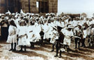View: FD03043 Helsby: Children forming procession by school.  Helsby Rose Fete 1912