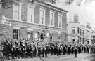 View: FD03231 Frodsham: Frodsham Volunteers march past, Town Hall.  C.1890