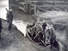 View: FD03278 Frodsham: Wildfowlers in boat by pumping station, side of Ship Canal.  