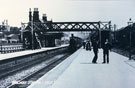 View: FD03590 Frodsham: Frodsham Station c.1900 Passengers are waiting on up local towards Chester.  Note goods facilities on both sides of the station.