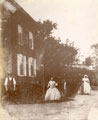 View: FD04885 Frodsham: People outside un-named house