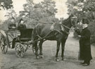 View: FD04909 Frodsham: Two Victorian ladies in poney-drawn trap, gentleman at poney's head