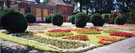 View: FD05036 Frodsham: Castle Park Grounds - Formal Gardens 2004.  House and Council Chamber boarded up.  