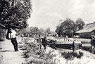 View: FD07397 Dutton: Man pulling flat [boat] along canal. Dutton Lock.