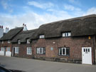 View: FD07509 Frodsham: Oak-framed thatched cottages Main Street