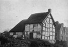 View: FDN0116 Sutton Weaver: half timbered thatched cottage.