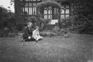View: FDN1034 Frodsham: Woman and girl in back garden of unknown house.  
