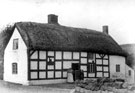 View: c00145 Woodhouses: Thatched cottage 	