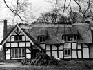 View: c05325 Whitegate: Thatching of a house in the village	