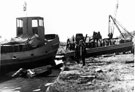 View: c06979 Northwich: Recovering a tug after launch at Pimblot's shipyard 	