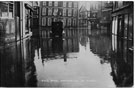 View: c07000 Northwich: Car in the flooded Bull Ring 	