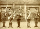 View: c12468 Soldiers with regimental colours and rifles at unknown location