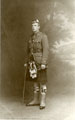 View: c12637 Studio portrait of a Scottish soldier wearing a kilt and holding a swagger stick