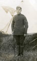 View: c12639 Corporal standing in front of a bell tent.
