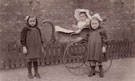 View: ch7668 Unidentified group of children with pram