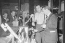 View: ch8948 Former Everton Footballer Bill 'Dixie' Dean, helping to pull a pint behind the bar of The Dublin Packet, Public  House, Chester