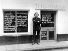 View: ch8963 Shopkeeper, Alan Brown outside his clothes shop 'Thingummytogs'