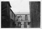 View: p0195 Stableyard with a horse's skeleton mounted on a wall in Princess St. Chester Sepia