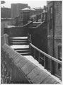 View: p0252 View of the walls near the Bridge Gate showing the steps leading up to the bridge, Chester Walls