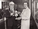 View: p1089 Mayor and Mayoress holding Trophy Cup presented by the Cheshire Artillery, 750th anniversary exhibtion.